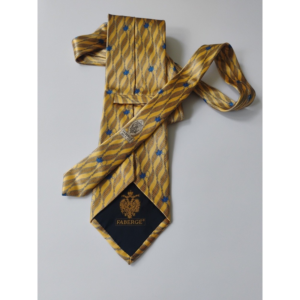 Fabergé 60" necktie blue and gold wave pattern  100% silk.
